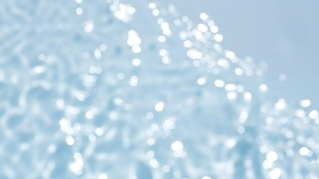 Close up view on Water texture with waves on the water overlay effect for video mockup toned in blue. Organic light drop shadow caustic effect with wave refraction of light. Slow motion video banner.