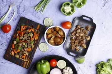 Barbecue chicken wings close up on wooden tray, shot with selective focus