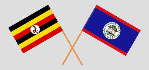 Crossed flags of Uganda and Belize. Official colors. Correct proportion