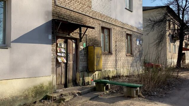 Terrible entrance to the house. The house was covered with mold, dirty and broken door to the entrance.