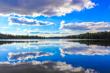 North Germany Stoteler See Lake blue water with cloud reflection.