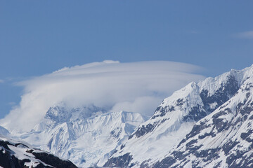 Orbital cloud formation (lenticular clouds) around an Alaskan mountain