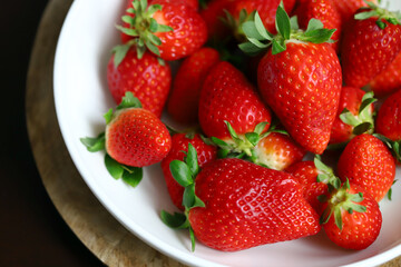 Fresh ripe strawberries in a bowl. Strawberry season.
