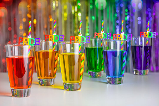 Rainbow drink. Glass of cocktail. Pride juice straw. Rainbow flag, symbol gays and lesbians LGBT, LGBTQ. Rainbow colors. Good for Party, greeting card. High resolution photo. Rainbow background.