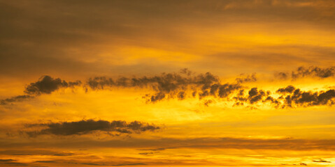 Fiery orange sky with clouds. Sky panorama at dusk