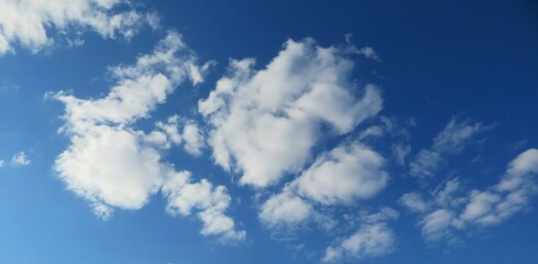 Beautiful fluffy clouds in blue sky