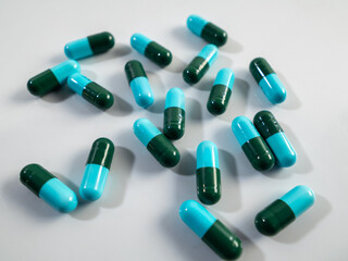 Pills drugs capsules on white background..