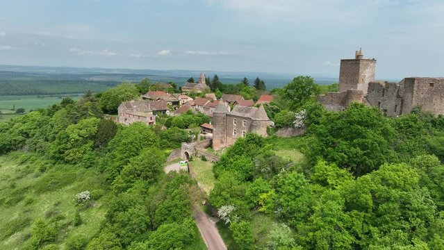 Aerial view of Brancion medieval village and castle largest fortress of Southern Burgundy above Grosne River of medieval military architecture