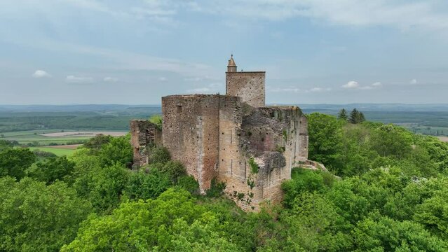 Aerial view of Brancion medieval village and castle largest fortress of Southern Burgundy above Grosne River of medieval military architecture