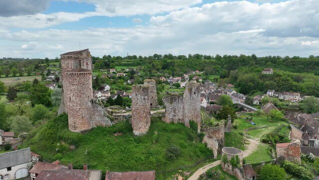 Aerial view of the ruins of Herisson fortress of the Dukes of Bourbon dominate the medieval city of H&eacute;risson and Aumance Valley with towers standing tall in the inner castle in central France