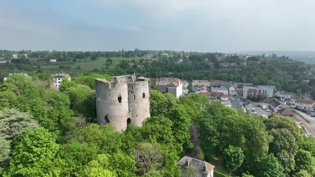 Aerial panning show of medieval castle above Etampes France with four concentric towers