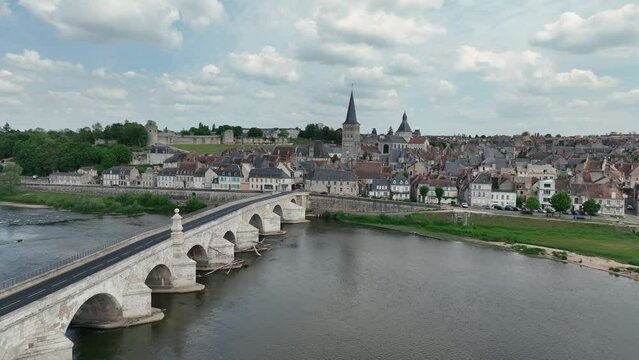 Aerial view of La Charit&eacute;-sur-Loire, charming medieval town on the bank of the Loire river with a historic bridge, bell tower, ramparts, Cluniac priory
