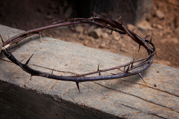 Copy space for Christian prayer text or quote with crown of thorns on old wood. Copy space and...