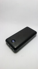 Powerbank new, powerful dark color with two usb inputs on a white background
