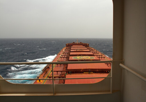 A Merchant Ship Underway At Sea In Rough Weather