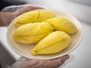 Durian peeled on white plate.