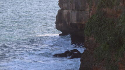waves crashing on rocks