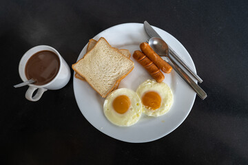 Breakfast is laid out on a beautiful plate