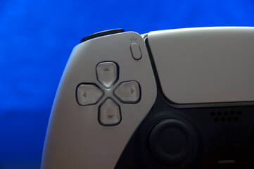 Next gen video game controller. Gamepad for console gaming, with dual sense capabilities to provide vibration and sound. 5th generation station to play modern games. It includes a touchpad. Left side.