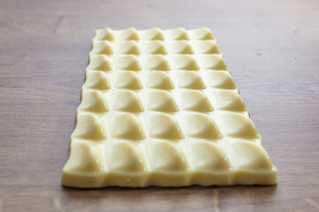 white chocolate bar on top of wooden table