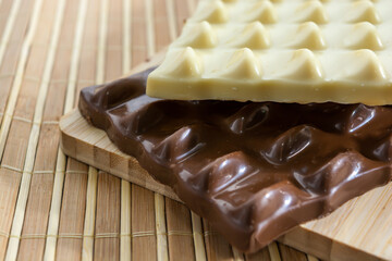 white chocolate and milk chocolate or dark chocolate concept background with delicious and creamy quality with text area