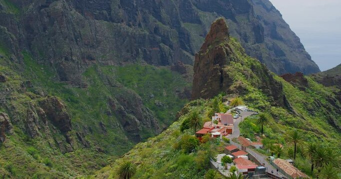 Masca village, green mountains gorge ravine in Tenerife, Canary Islands, Spain. Sunny day. Famous touristic destination.