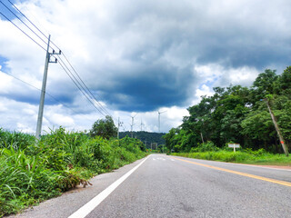 Natural background.blue sky,tree,road and electric cable.country in Thailand.mukdahan from Thailand.after raining.