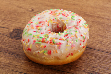 Sweet glazed vanilla donut with icing