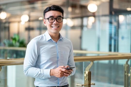 Asian Businessman Male Portrait At His Workplace