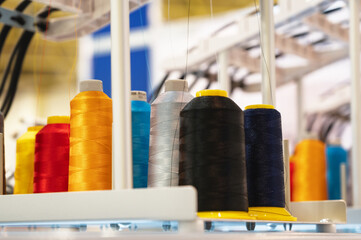 Set of coils with colorful threads on embroidery machine