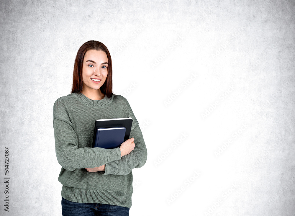 Poster attractive businesswoman wearing casual wear is standing holding