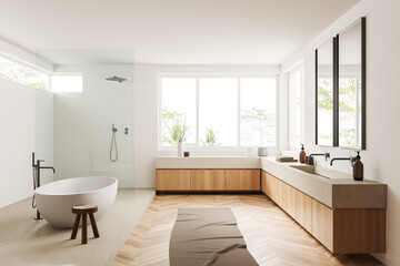 Fototapeta na wymiar Light bathroom interior with bathtub, shower, sink and panoramic window