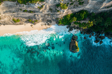 Aerial drone top view shot of rocky beach with cliff. Indian ocean shore. Copy space for text....