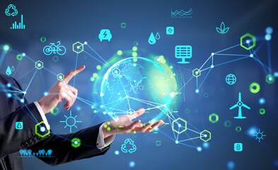 Businessman hold earth hologram and eco energy hud, resources