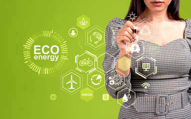 Businesswoman with pen touch eco energy digital hud interface with icons