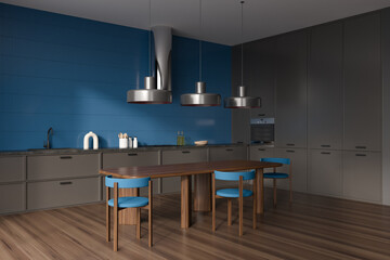 Blue kitchen interior with seats and eating table on wooden floor