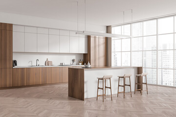 Light kitchen interior with countertop and seats, shelves and decoration, window