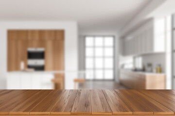 Wooden island on blurred background of light kitchen interior. Mockup