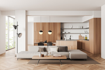 Light kitchen interior with lounge and eating area, panoramic window