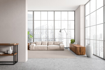 Front view on bright living room interior with sofa