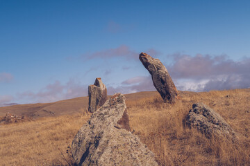 Megalithic standing stones and burial mound of Zorats Karer or Carahunge - prehistoric monument in...