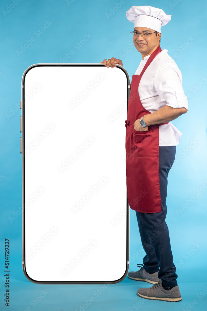 Poster chef with big phone. app recommendation by cook. chef man and mock up smartphone. phone in front of 
