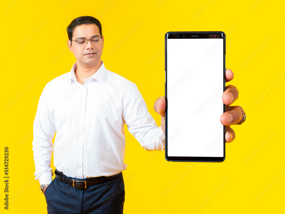 Poster man phone. empty cell phone in guy hand. gadget displays blank screen. copy space in cellphone. smar