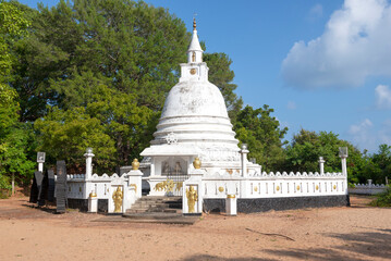 Buddhist stupa in the grounds of the Vijayangarama Temple on a sunny day. Trincomalee