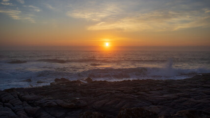 Fototapeta premium Early morning sunrise on the south coast of South Africa in Margate with people catching fish