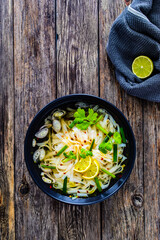 Pho soup - Vietnamese soup on wooden table