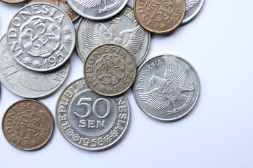 Pile of Indonesian 1950s old coins, 25 cents Rupiah and 50 cents Rupiah.