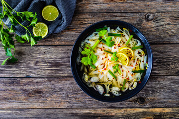 Pho soup - Vietnamese soup on wooden table