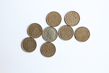 Eight old Indonesian 1952 old coins of 50 cents Rupiah on white background.