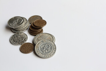 Pile of Indonesian 1950's old coins, 25 cents Rupiah and 50 cents Rupiah.